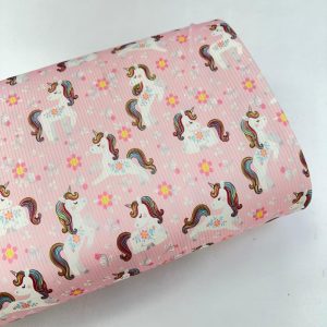 پارچه تریکو میله ای صورتی طرح یونیکورن