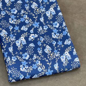 خرید پارچه تریکو میله ای سرمه ای طرح گل آبی