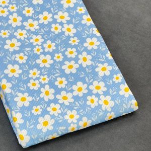 خرید پارچه تریکو میله ای آبی طرح گل سفید درشت