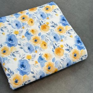 پارچه تریکو میله ای سفید طرح گل زرد آبی