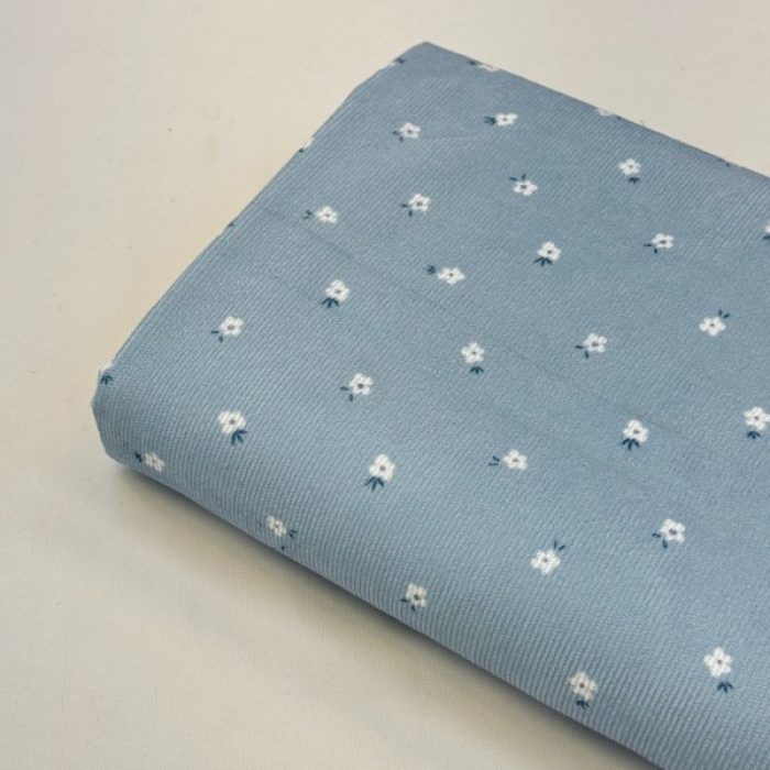 پارچه مخمل کبریتی زمینه آبی گل ریز